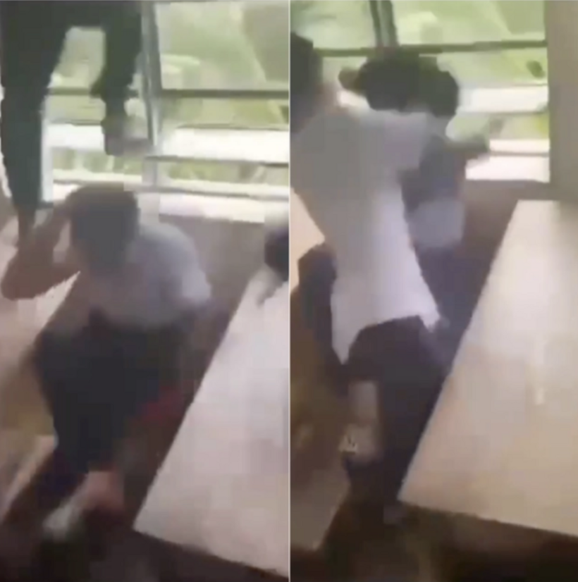 Nhóm học sinh đánh bạn tại Trường THCS Trung Hiếu và quay clip. (Ảnh cắt từ clip)