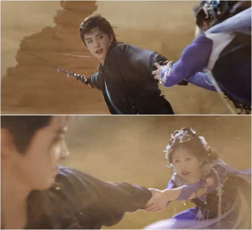 Phạn Việt vừa nắm chắc vũ khí, vừa giữ chặt tay Bạch Lộc khi cả hai rơi vào trận cát.