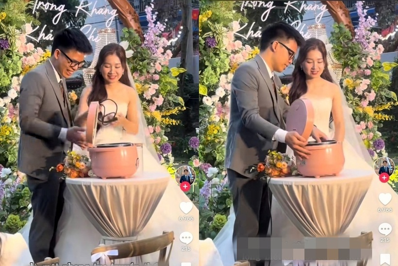 Chiếc nồi cơm điện màu hồng được đặt trên bàn, cô dâu và chú rể cùng nhau đổ gạo, nước vào nồi và cắm điện. Ảnh: Báo Thanh niên.