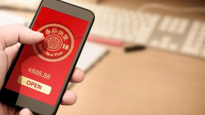 Thay vì lì xì theo kiểu truyền thống, hàng trăm triệu người Trung Quốc đã lựa chọn gửi tiền qua hồng bao điện tử trên ứng dụng WeChat. Ảnh minh họa/ Shutterstock.