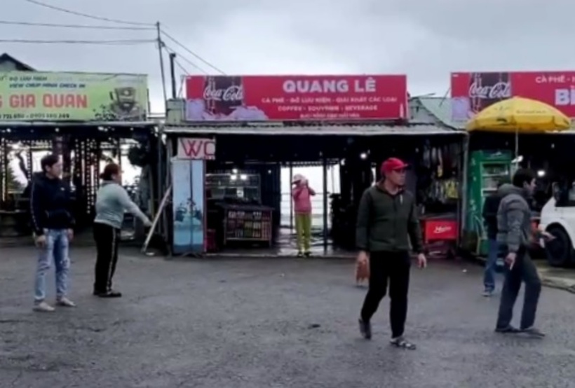 Trong clip đánh nhau trên đỉnh đèo Hải Vân, một người phụ nữ lên tiếng thách thức "cứ quay đi", "ở đây có chủ tịch"... Ảnh: Người Lao Động.