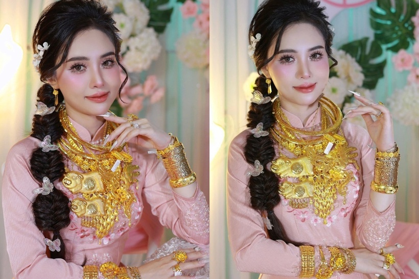 Cô dâu đeo nhiều vòng vàng, lắc vàng, nhẫn vàng trong ngày cưới. Ảnh: Vietnamnet.