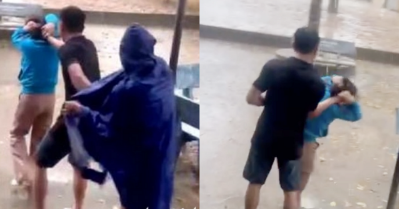 Nữ giáo viên (áo xanh) bị ông Thúy mặc áo đen túm tóc, đẩy ra giữa sân trường khi trời đang mưa. Ảnh: Tuổi trẻ