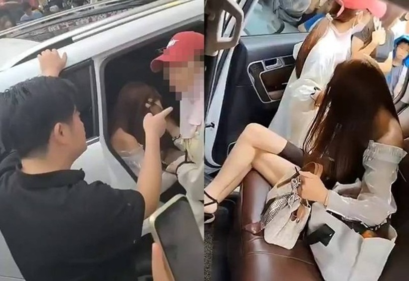 Người phụ nữ cúi đầu, dùng tóc che mặt để tránh ánh mắt của mọi người. Ảnh: Người đưa tin.