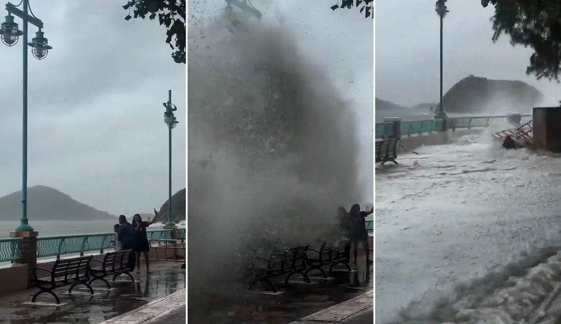 Trong khi người phụ nữ đang giơ điện thoại để chụp selfie, cơn sóng lớn đập vào bờ bất ngờ, hất văng cả 3 người về phía vỉa hè.Ảnh: Ngôi sao.VnExpress.