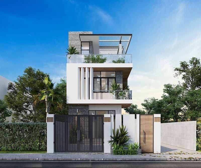 Mẫu nhà với mặt tiến được nhấn nhá với tông màu nhã nhặn kết hợp với các chất liệu đơn giản nhưng tạo nên một diện mạo mới mẻ hiện đại như kính, gỗ, đá ốp. Ảnh: Wedo Architecture & Construction