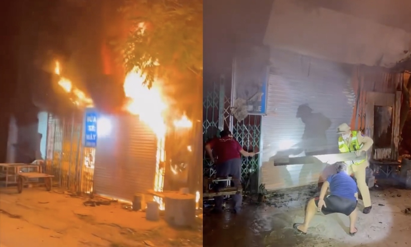 Lực lượng CSGT đã phá cửa giải cứu thành công 11 người trước khi ngọn lửa bùng lên dữ dội. (Ảnh: Báo Xây dựng).