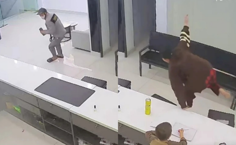 Người đàn ông cướp điện thoại bỏ chạy, chị H. leo qua mặt quầy bán hàng đuổi theo. (Ảnh: PLO)