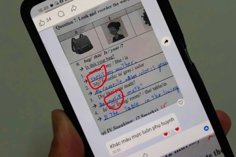 Giáo viên tiếng Anh sửa bài thi của học sinh bị kỷ luật cảnh cáo và xem xét bố trí nhiệm vụ khác. Ảnh: Dân trí