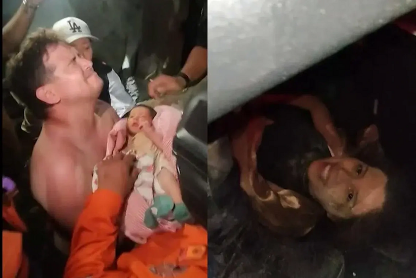 Em bé và mẹ được đội cứu hộ đưa ra khỏi đống đổ nát. (Ảnh: AFP)
