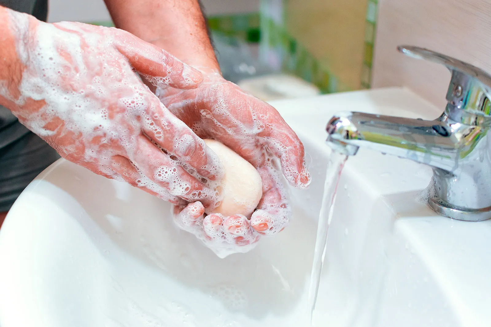 washing hands with bar of soap