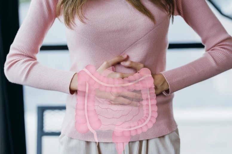 woman holding stomach gut digest