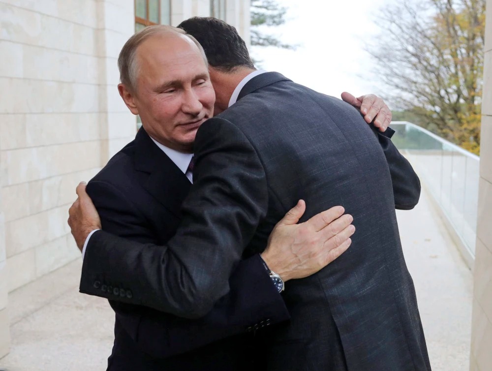 171121 putin assad hug mc 1044