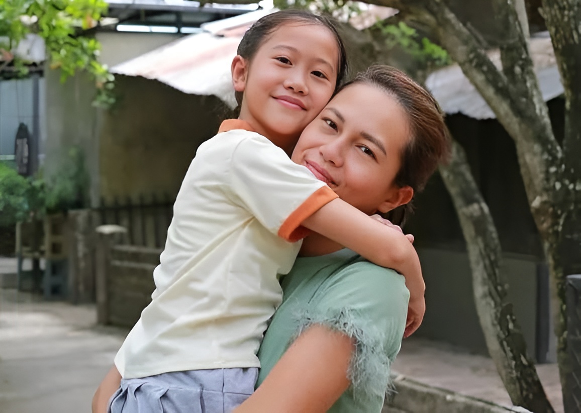 happy asian mother carrying her daughter looking camera garden outdoors mum spending time together summer park happy 304798985 picsart aiimageenhancer