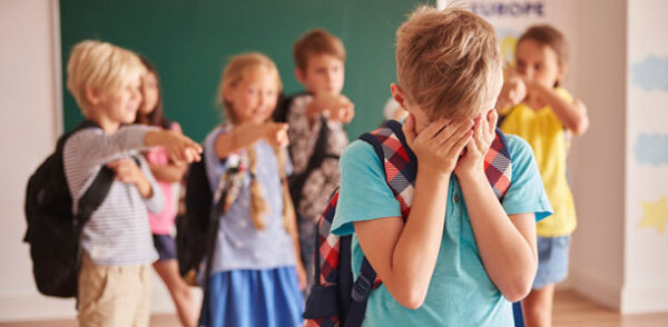 child boy crying classmates bullying 600x294