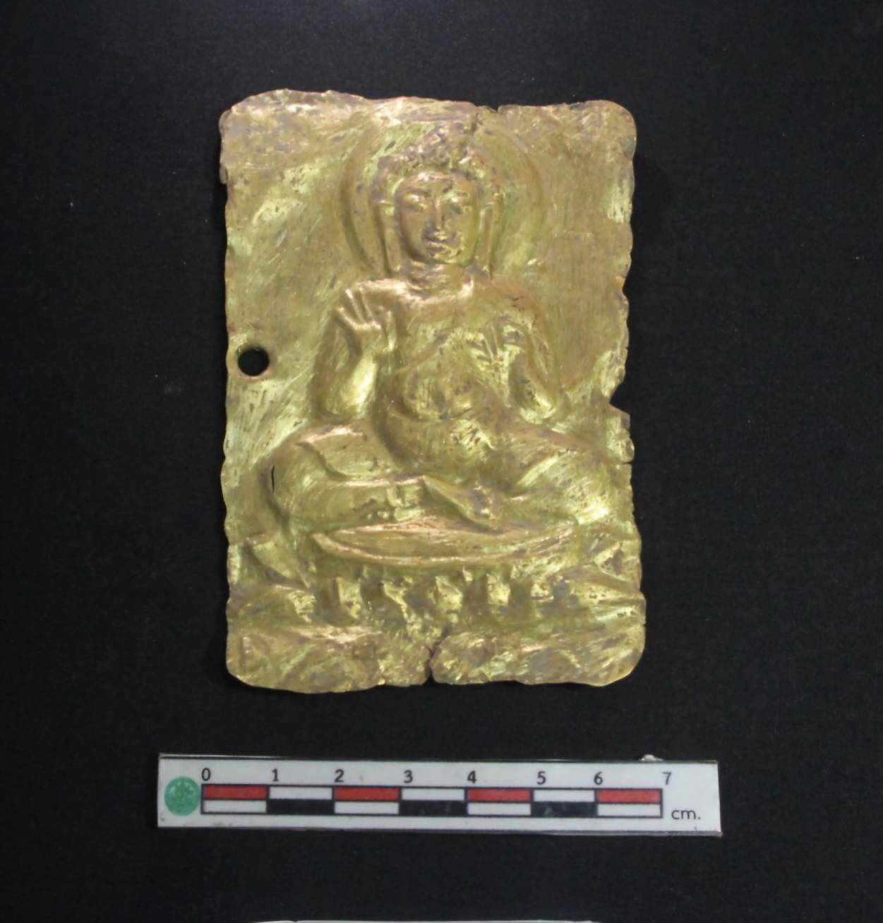 rectangular gold sheet embossed with a seated buddha image