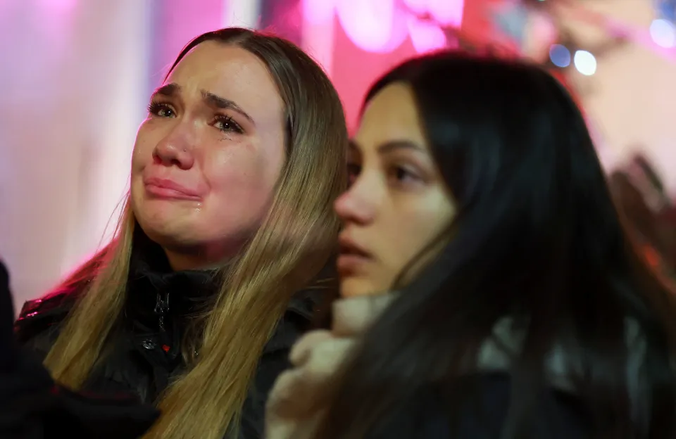 woman reacts outside le constellation 1048894572