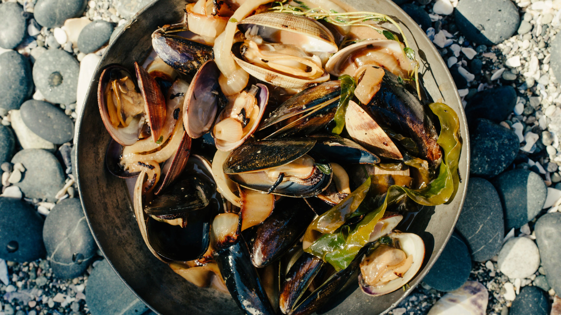 stout steamed shellfish with kelp and charred onions 1