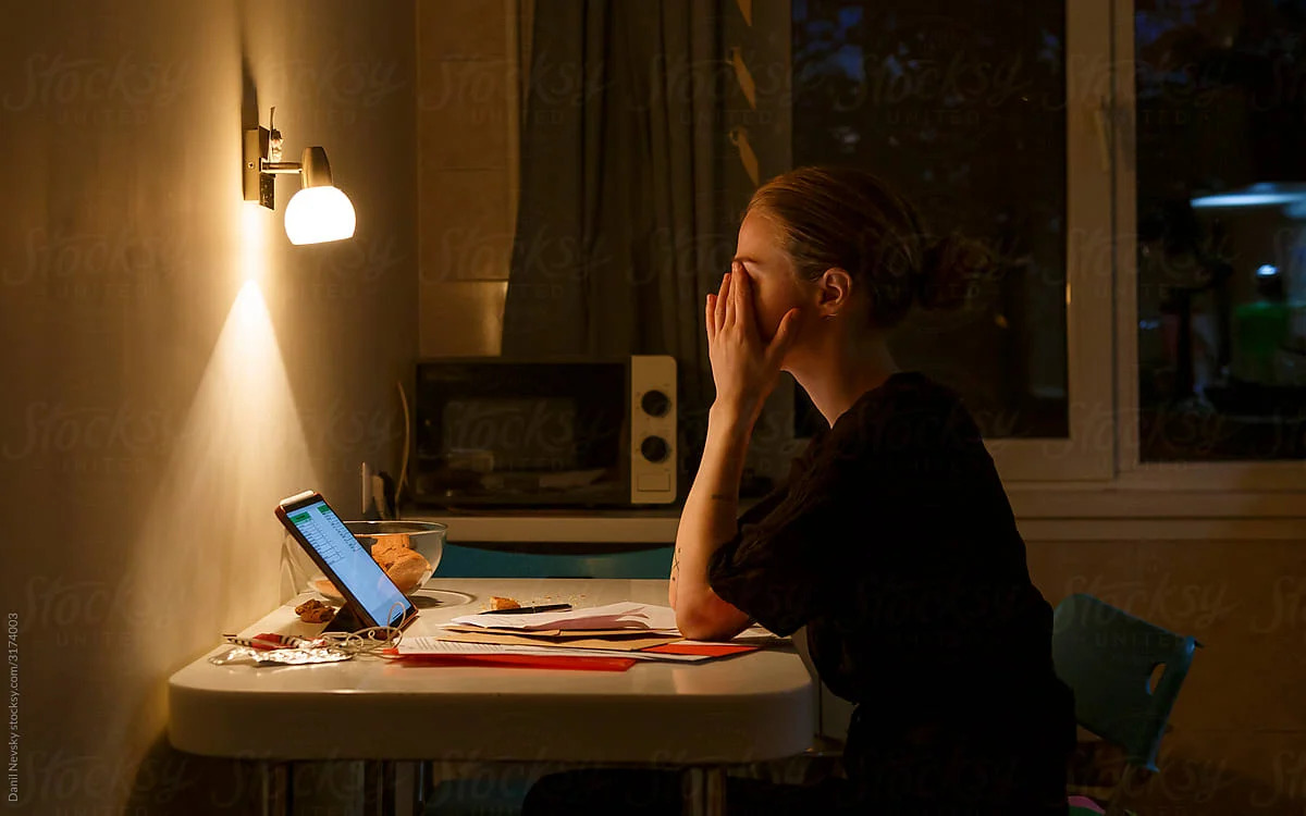 woman working late mental exhaustion