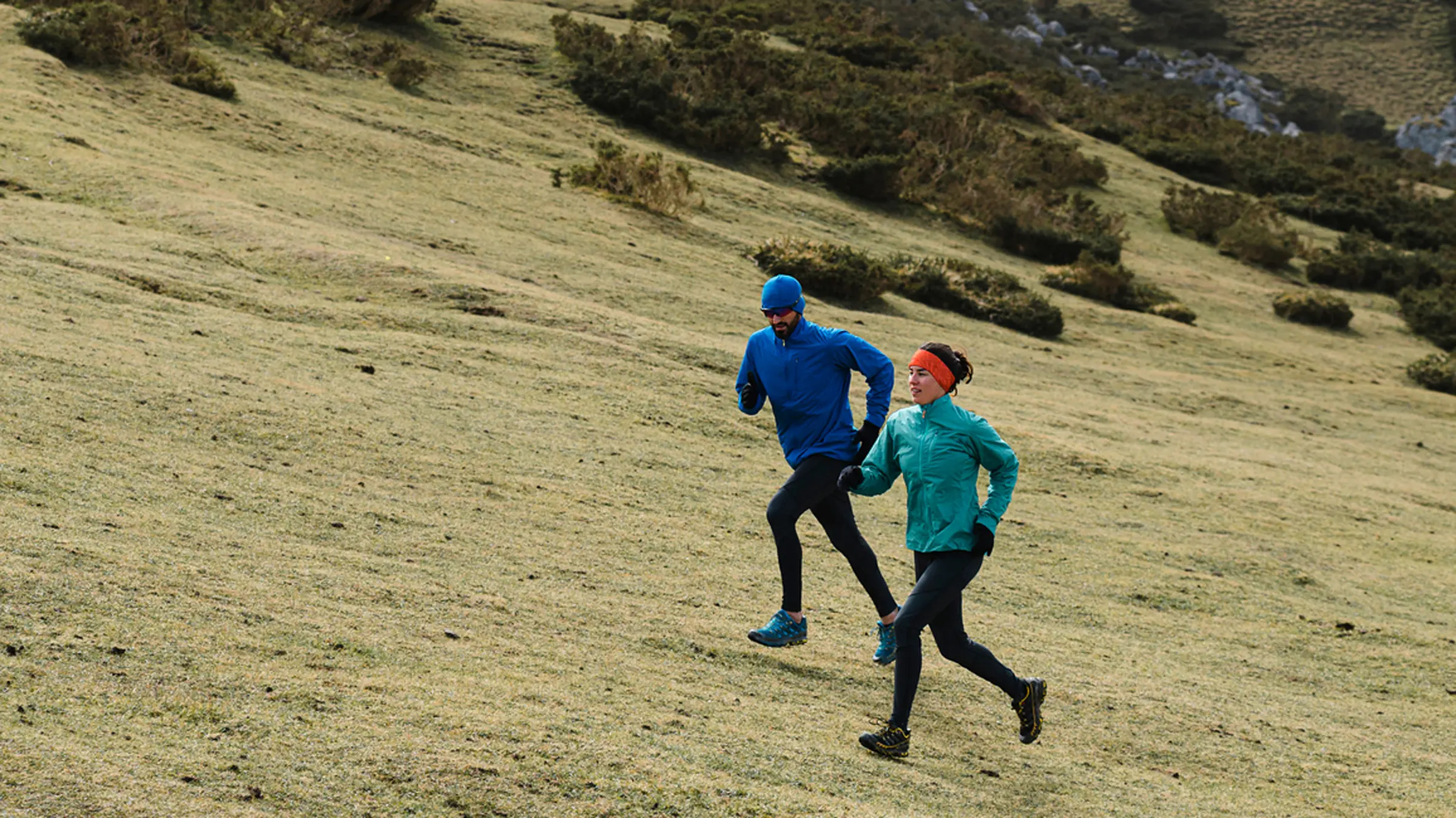 two ppl running uphillh