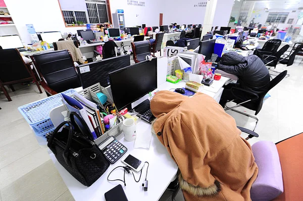 depositphotos234218512 stock photo chinese employees take nap work