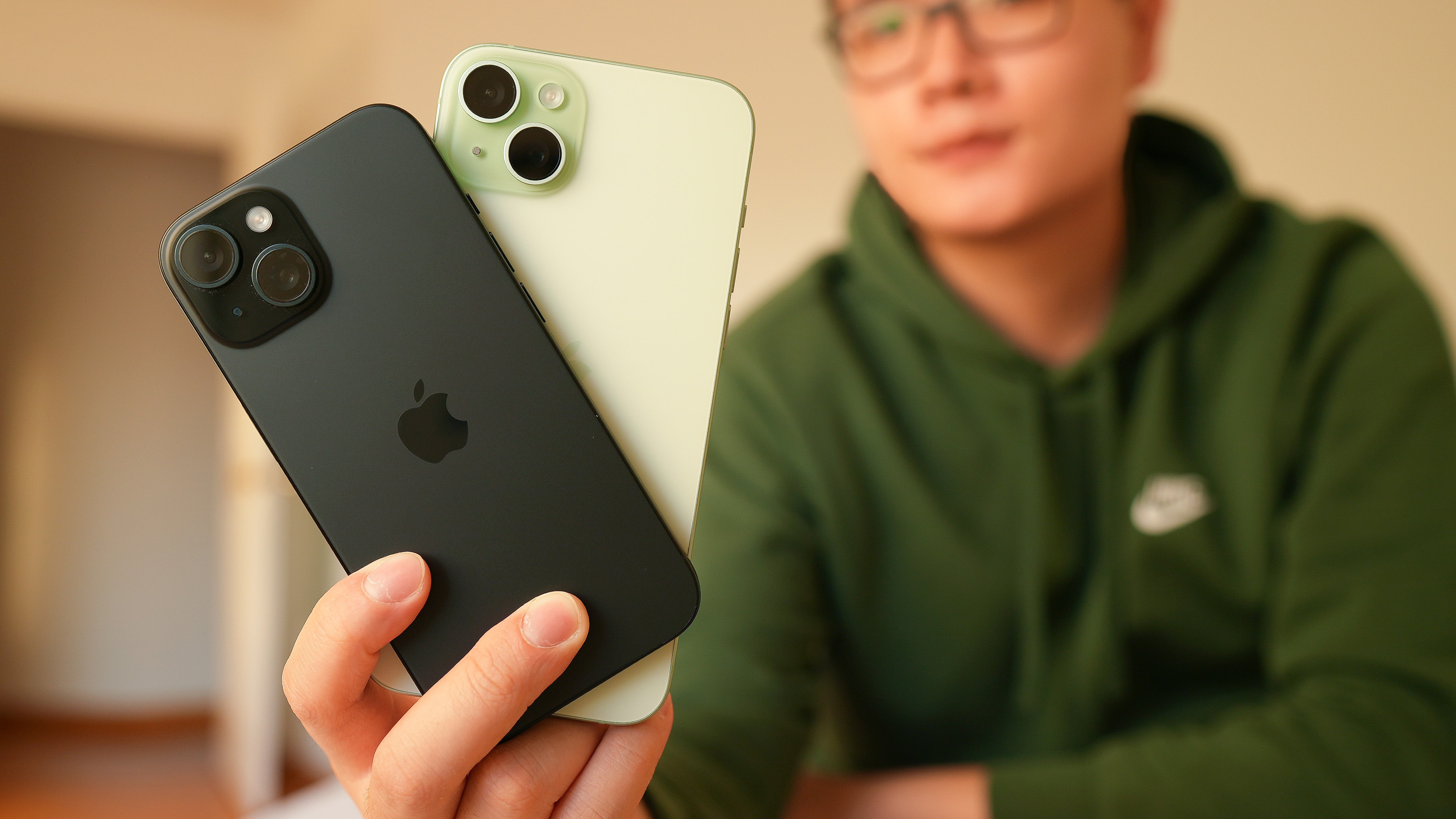 iphone 15 and iphone 15 plus in hand copy