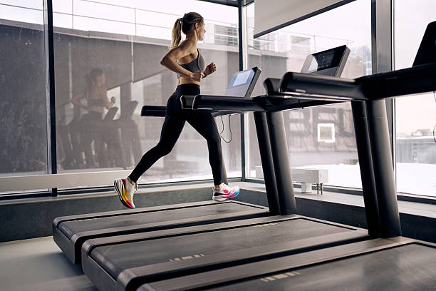 focused treadmill running in modern gym 17749510919551365460869