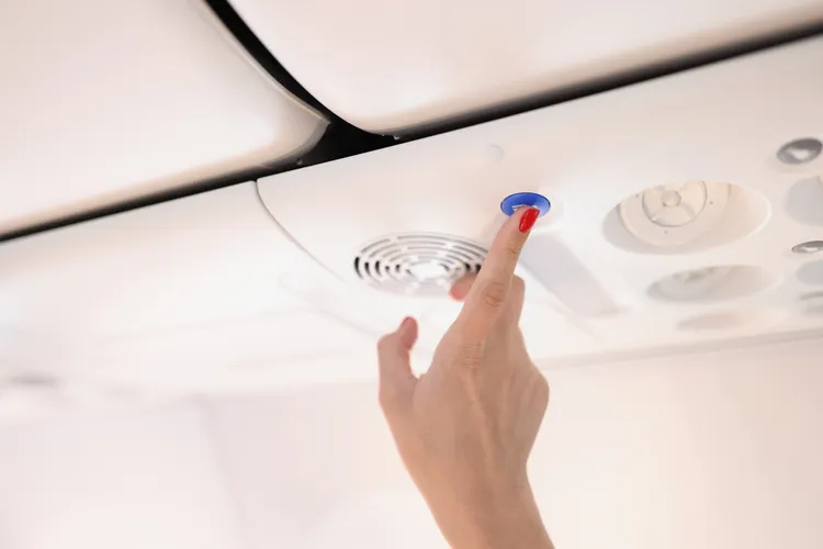 talpressing a flight attendant c