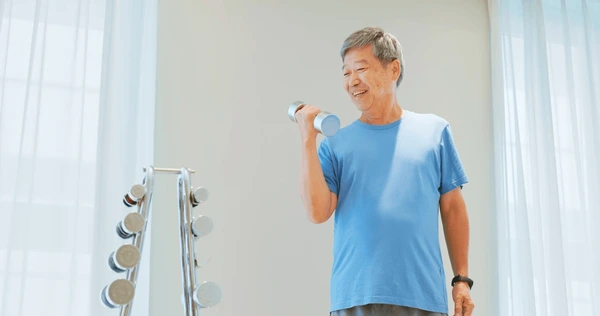 asian elder man lifts dumbell 600nw 2119239890