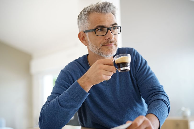middle aged man drinking coffee at homegoodluzshutterstock