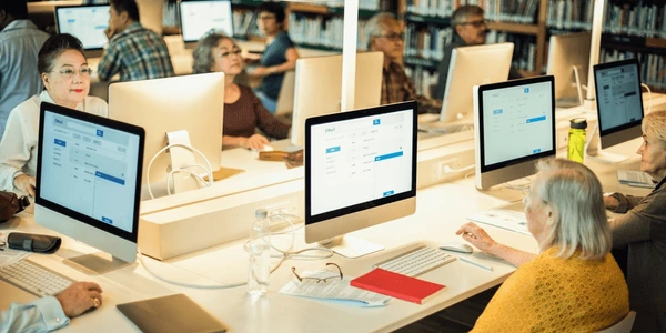 people using computers library seniors 600nw 2580819837