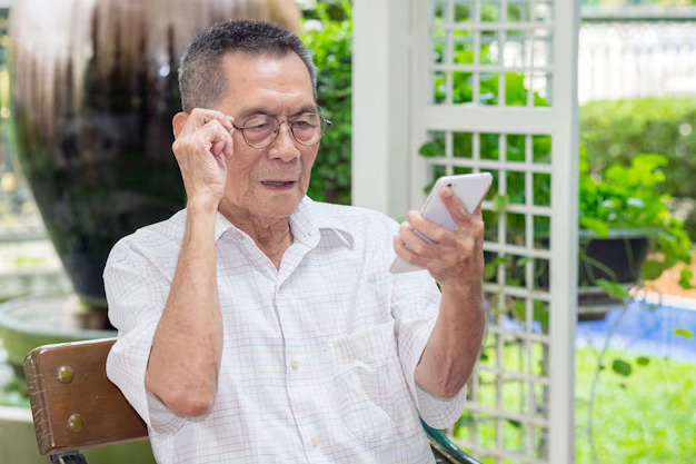 happy elderly asian old man hold eye glasses looking smartphone outdoor37129 837