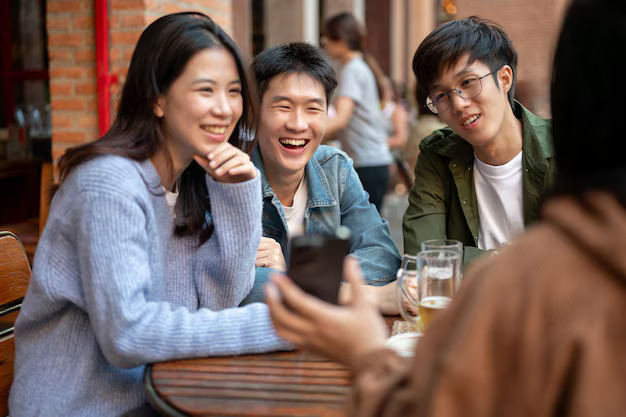 group cheerful young asian friends are enjoying talking while hanging out bar together67155 41940