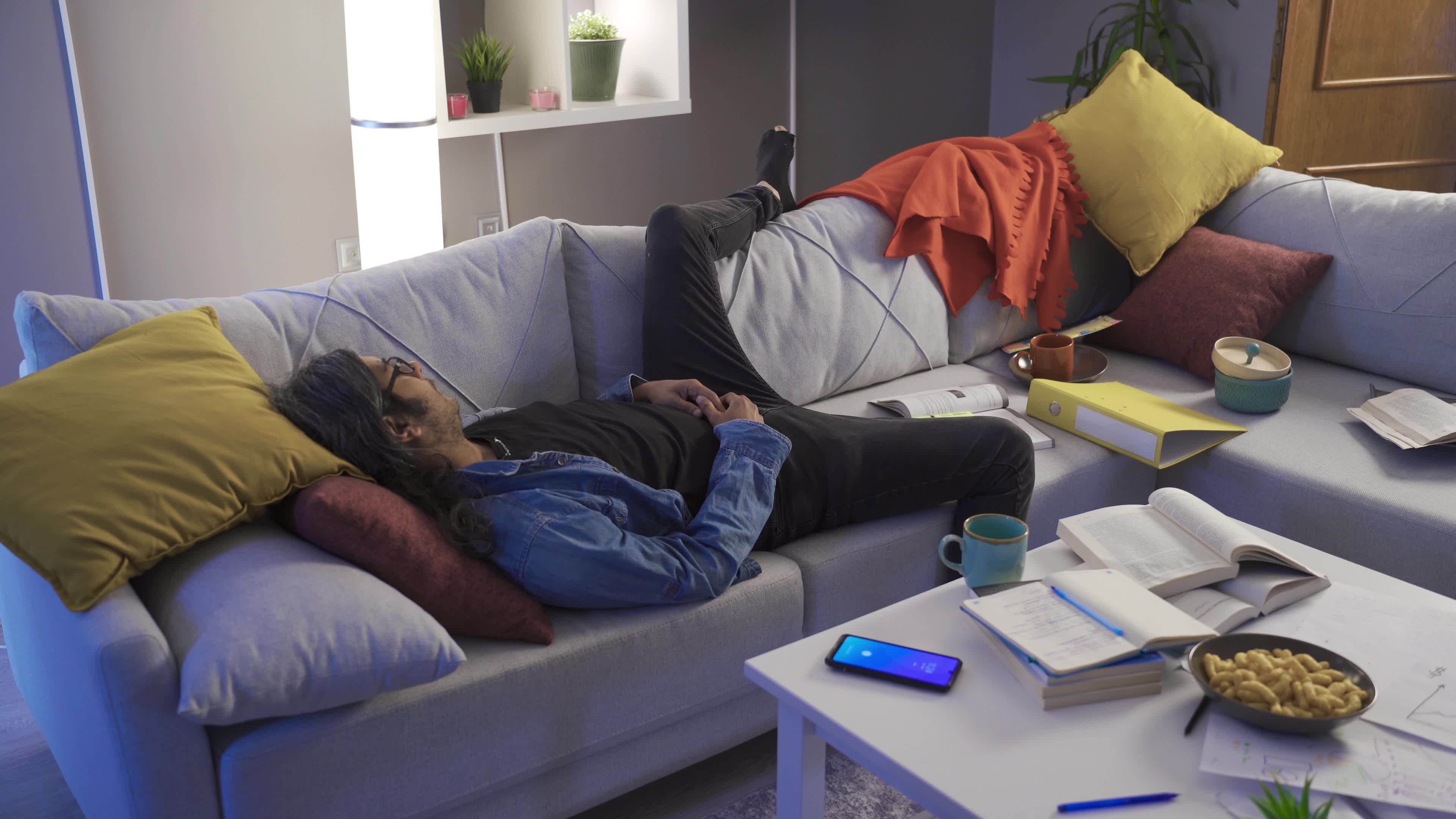 lazy man sleeps and turns off the alarm the lazy man living in the messy and dirty house sleeps and turns off the alarm and goes back to sleep video