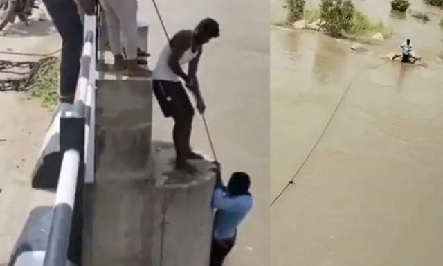 Clip: Người đàn ông bất ngờ rơi xuống sông khi đang chụp ảnh với vợ, may mắn thoát nạn trong gang tấc