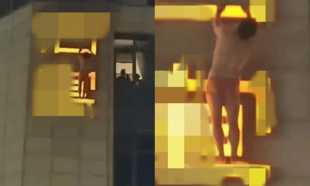 Người đàn ông treo lơ lửng trên biển hiệu khách sạn, dân tình nghi ngờ bị vợ bắt ngoại tình