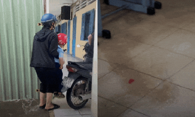 Trường học ở TP.HCM ngập sau mưa lớn, phụ huynh cõng con vào lớp