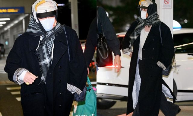 Ngay lúc này: G-Dragon thời trang phang thời tiết, trùm khăn hoa cúc kín mít khời hành sang Việt Nam