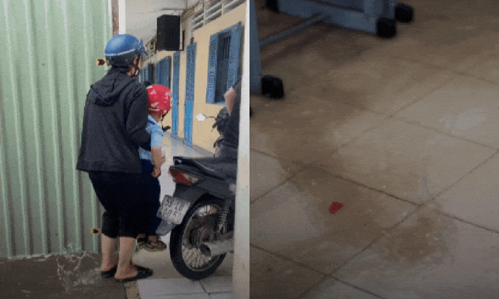Trường học ở TP.HCM ngập sau mưa lớn, phụ huynh cõng con vào lớp