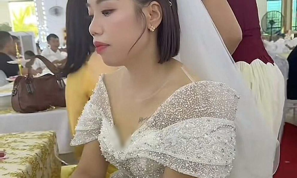 Cô dâu ngồi thất thần trong đám cưới vắng chú rể, câu chuyện phía sau khiến nhiều người thương cảm