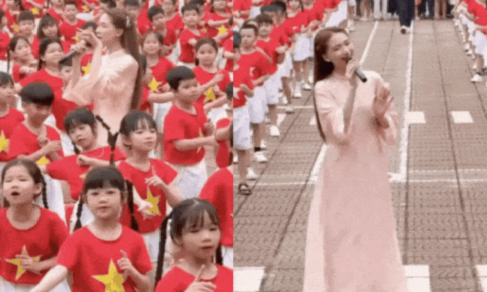 Cực hot khoảnh khắc Hoà Minzy hát giữa dàn em nhỏ rợp màu áo đỏ sao vàng: Sức mạnh Bắc Bling quá tuyệt vời!